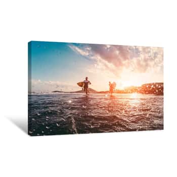 Image of Happy Urfers Running With Surf Boards On The Beach - Sporty People Having Fun In Sunny Day - Extreme Sport, Travel And Vacation Concept - Focus On Bodies Silhouettes - Water On Camera Lens Canvas Print