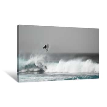 Image of Surfer Jumping On A Wave Canvas Print