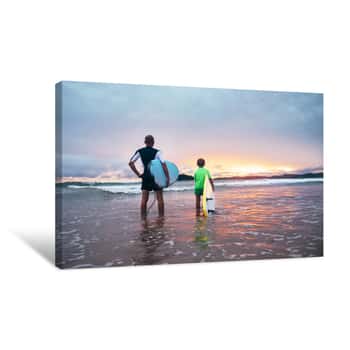 Image of Father And Son Stand On The Surf Line With Surf Boards On Sunset Canvas Print