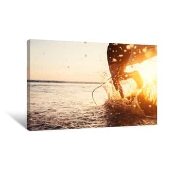 Image of Man Surfer Run In Ocean With Surfboard  Closeup Image Water Splashes And Legs, Sunset Light Canvas Print