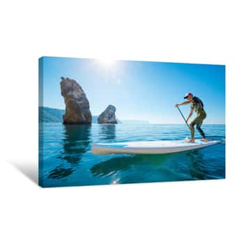 Image of Stand Up Paddle Boarding  Young Man Floating On A SUP Board  The Adventure Of The Sea With Blue Water On A Surfing Canvas Print