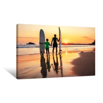 Image of Father And Son Surfers Meet A Sunset On The Ocean Beach Canvas Print
