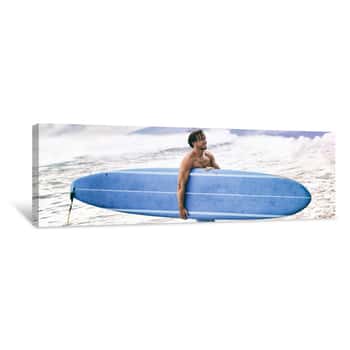 Image of Surfer Coming Out Of Ocean Walking In Waves After Surf Session Surfing Lifestyle In Maui, Hawaii, USA Banner Panorama  Man Standing With Blue Longboard Surf Board  Active Beach Watersport Lifestyle Canvas Print