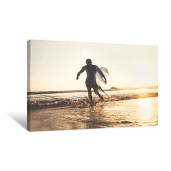 Image of Surfer With Surfboard Runs In Ocean Waves, Sunset Time  Active Lifestyle Concept Canvas Print