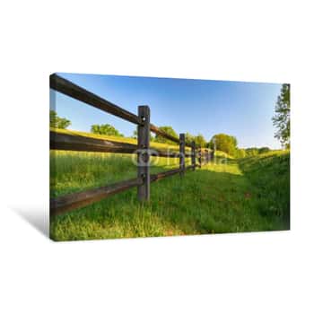 Image of "The Fence" Americana Series A Rustic Wood Fence Runs Along A Lush Green Pasture Canvas Print