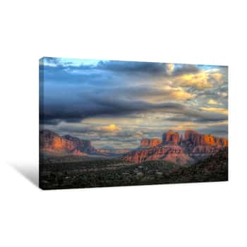 Image of Lat Rays Of Sunlight On Cathedral Rock In Sedona Arizona With Building Storm Clouds Moving In Canvas Print