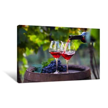 Image of Pouring Red Wine Into Glasses In The Vineyard Canvas Print