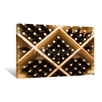 Image of Stacked Bottles Of Grape Wine In A Wine Cellar Canvas Print