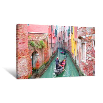 Image of Venetian Gondolier Punting Gondola Through Green Canal Waters Of Venice Italy Canvas Print