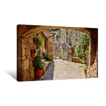 Image of Arched Cobblestone Street In A Tuscan Village, Italy Canvas Print