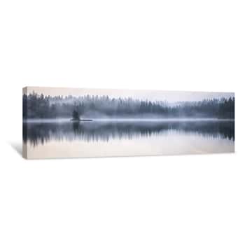 Image of Panoramic Shot Of The Sea Reflecting The Trees On The Shore With A Foggy Background Canvas Print