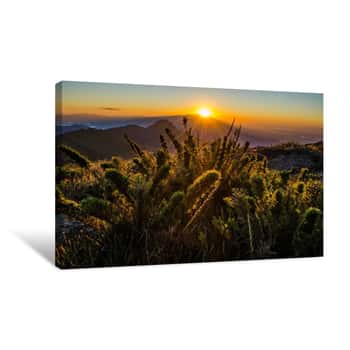 Image of Breathtaking View Of Forested Mountains Under An Orange Sky At Sunset Canvas Print