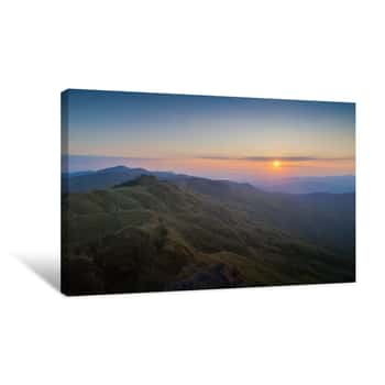 Image of Mountain View Morning Above Many Hills And Green Forest Around With Soft Fog With Colorful Red Sun Light In The Sky Background, Sunrise At Top Of Phu Langka Forest Park, Phayao, Thailand Canvas Print