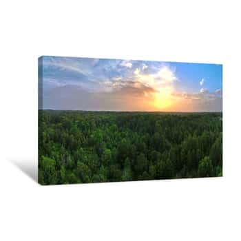 Image of A Beautiful Sunset From Above The Trees With A Partly Cloudy Sky Canvas Print