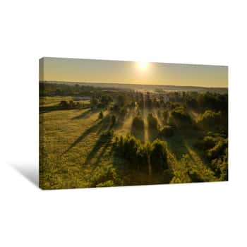 Image of Panoramic View Of Green Meadows In The Morning Haze At Sunrise Shot From A Drone At Dawn Canvas Print