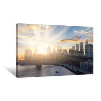 Image of Sunlight Shines Behind New York City Skyline Canvas Print