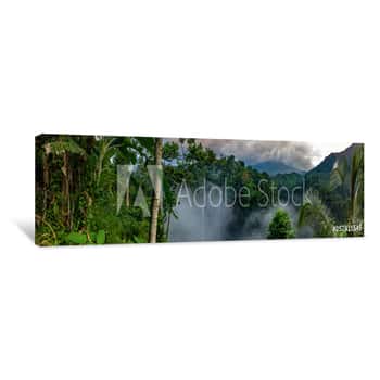 Image of Aerial Over Sekumpul Waterfall Surrounded By Dense Rainforest And Mountains Shrouded In Mist At Sunrise, Bali, Indonesia Panoramic Canvas Print