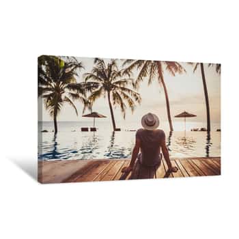 Image of Tourist In Luxury Beach Hotel Near Luxurious Swimming Pool At Sunset, Tropical Exotic Holidays Vacation, Tourism And Travel Canvas Print