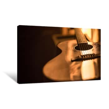 Image of Acoustic Guitar Close-up On A Beautiful Colored Background Canvas Print