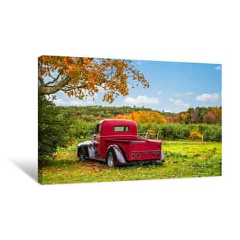 Image of Old Antique Red Farm Truck In Apple Orchard Against Autumn Landscape Background  Blue Sky On A Sunny Fall Day In New England  Canvas Print