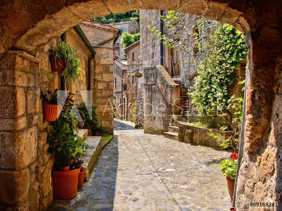 Arched Cobblestone Street In A Tuscan Village, Italy Wall Mural