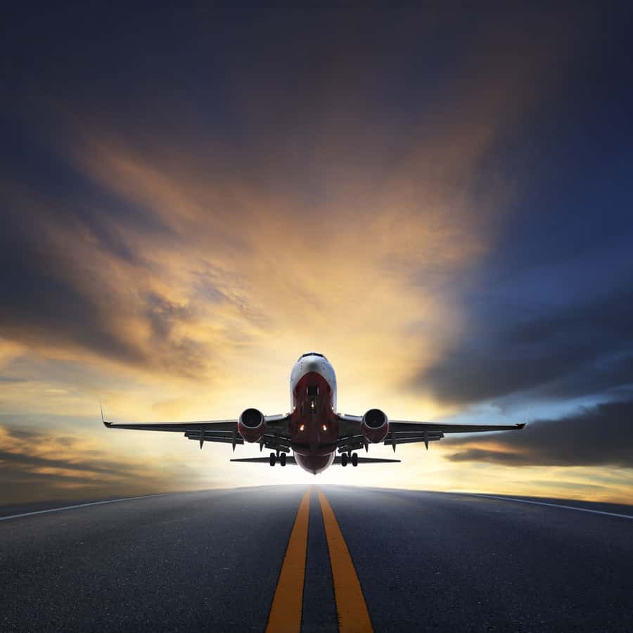 Plane landing on a road wall mural