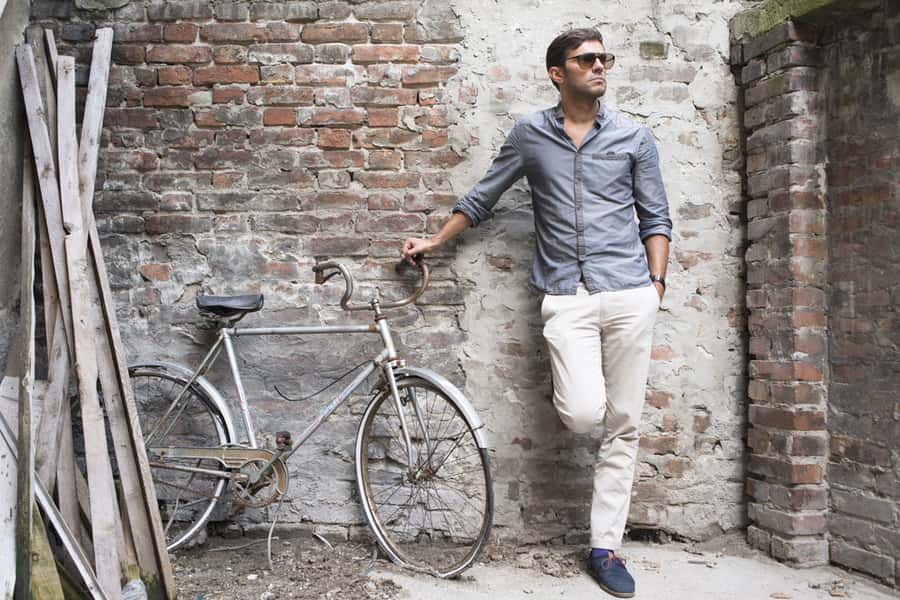 Man With His Bicycle in front of a brick wall, Wall Mural